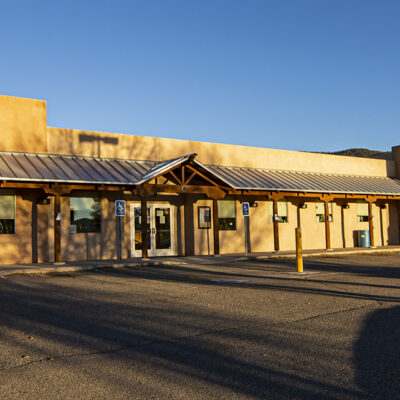 Pediatric clinic building with a welcoming entrance, designed for children's healthcare in Taos, New Mexico.