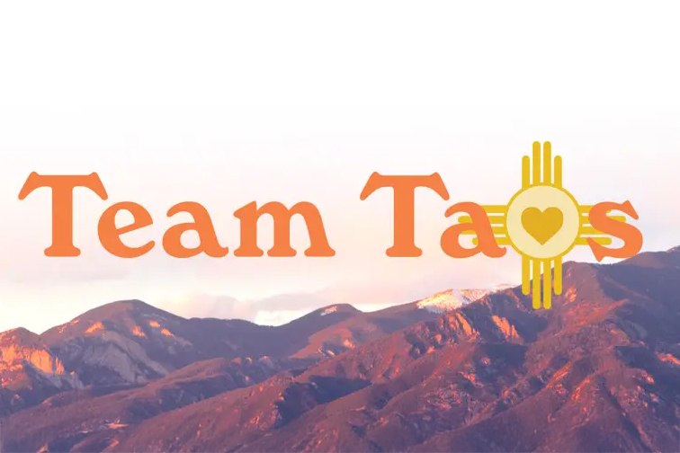 Team Taos logo with mountains in the background, symbolizing community and recruitment efforts at Holy Cross Medical Center.
